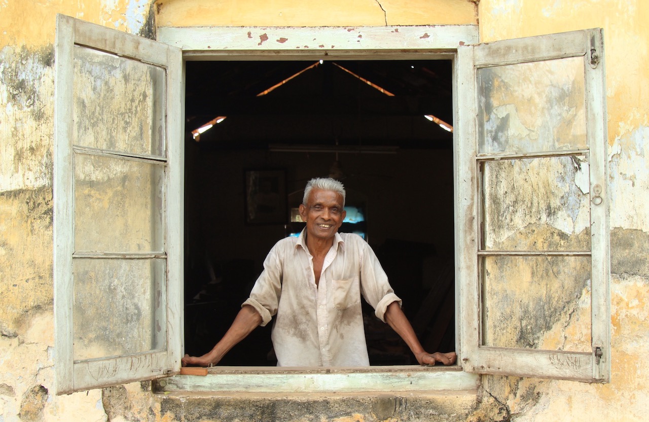 Despite living with leprosy, Ananda supports himself and his family through woodworking.