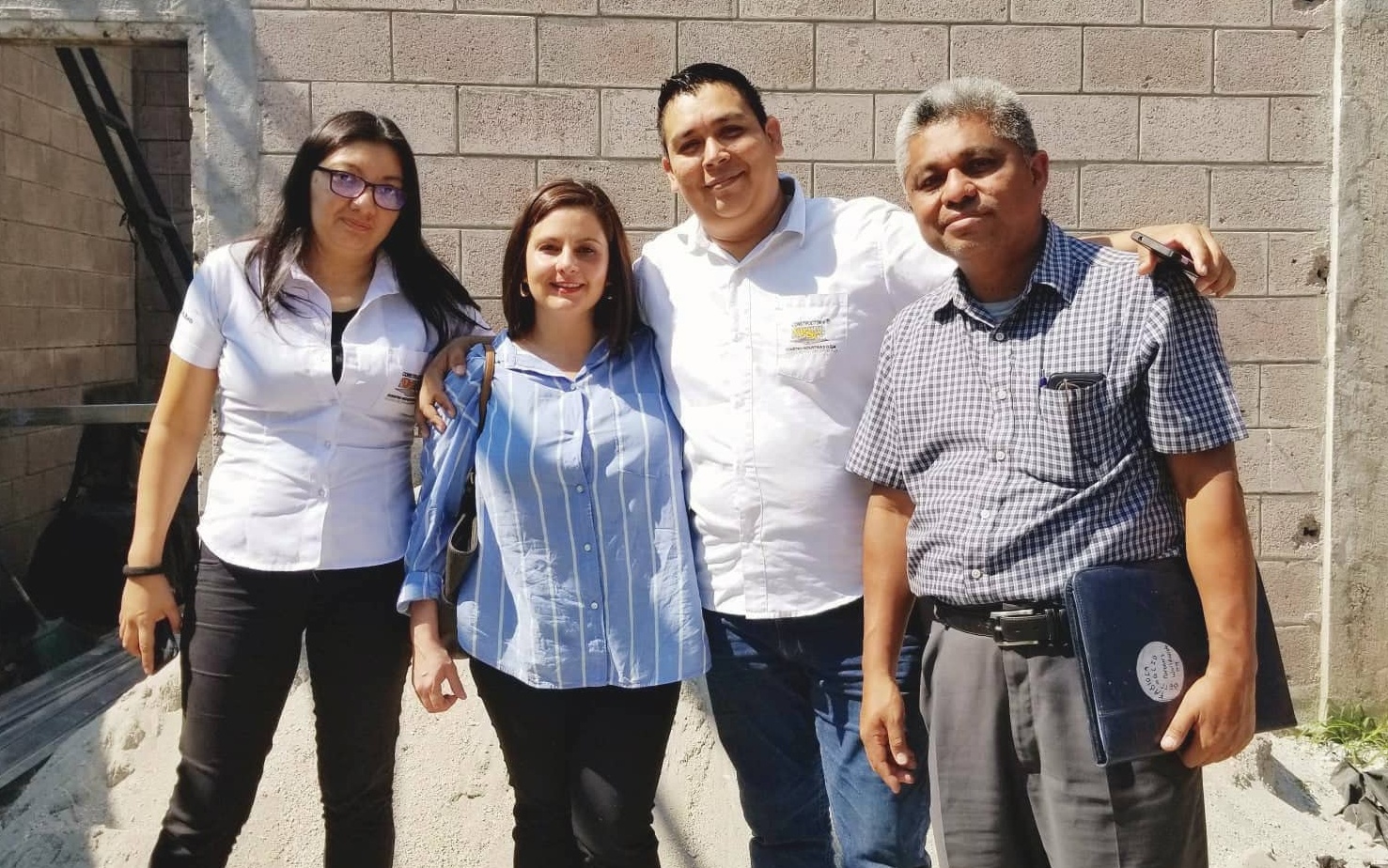 Yesenia, Partners Worldwide staff member Fabiola, Alex, and Pastor Chiacas