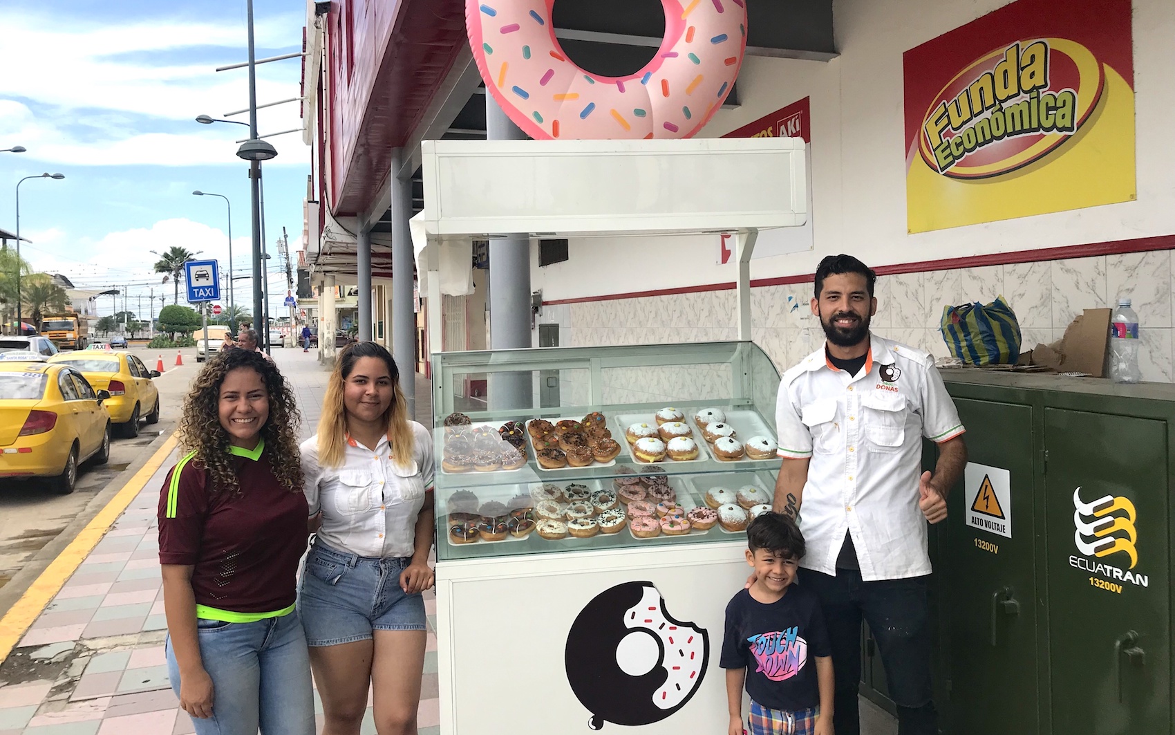 Rafael (pictured on left) with son Thiago, Yorliana, and an employee.