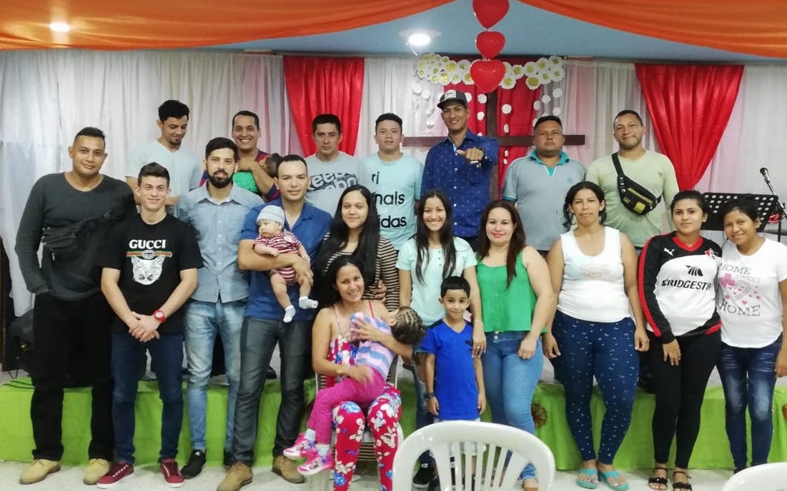 Venezeuelans who came to Ecuador as refugees pictured with members of the Partners Worldwide local network.