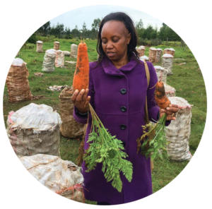 PW Partnership Manager Grace Muchiri visits Peter’s farm. 