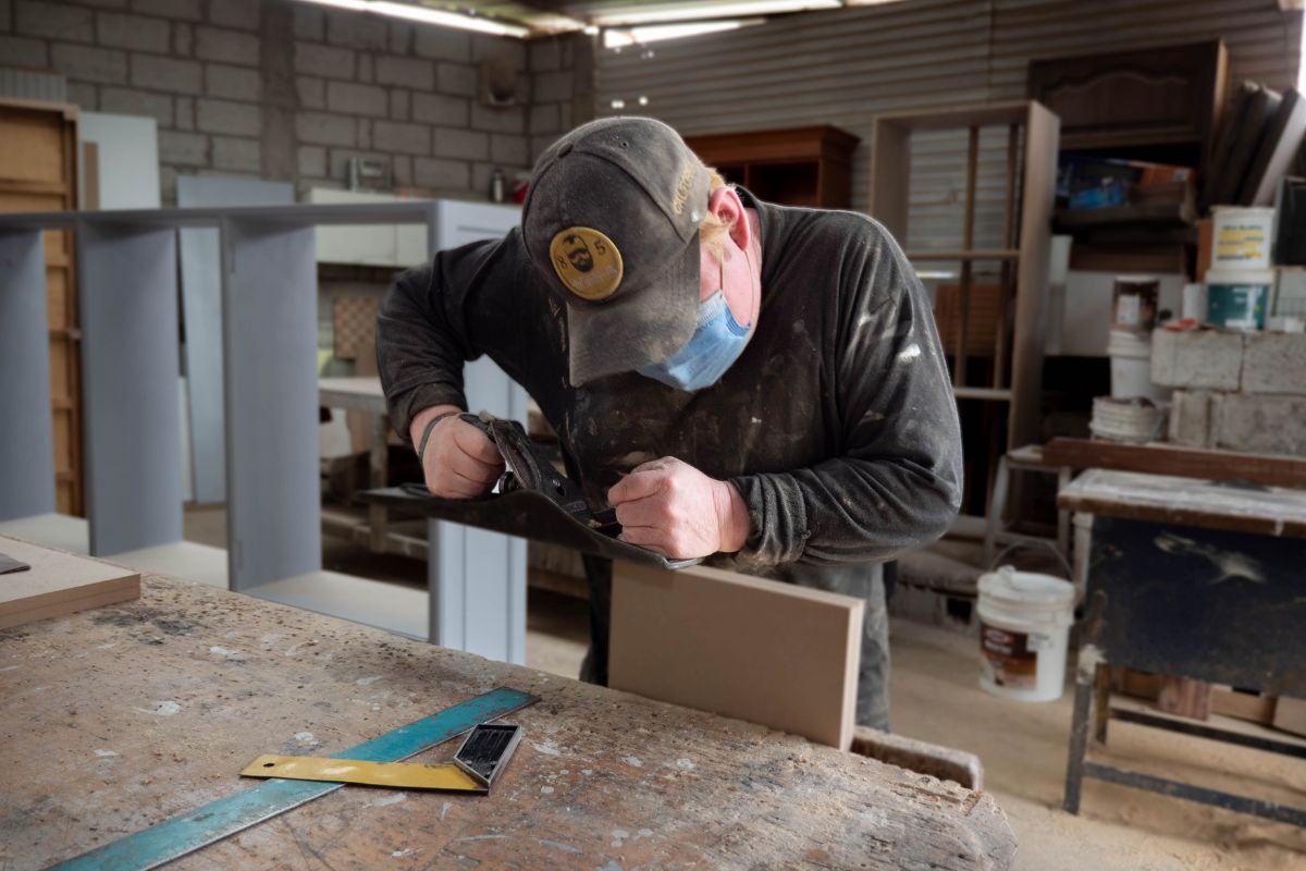 Marco working on a project in his workshop