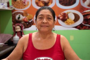 a woman in a red tank top