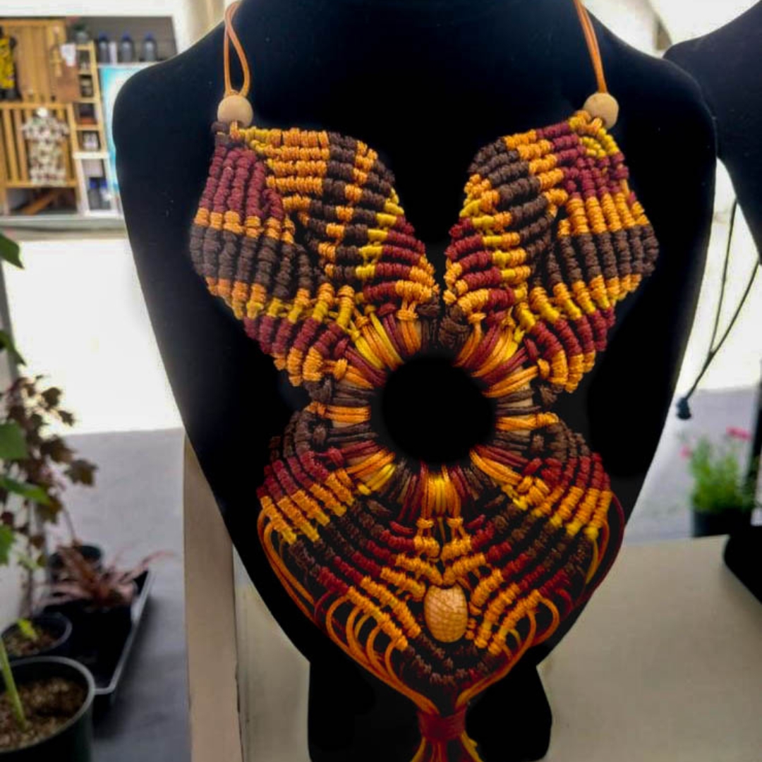 an orange macrame necklace