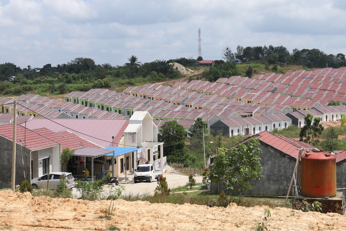 a row of housing units on a sloped hill