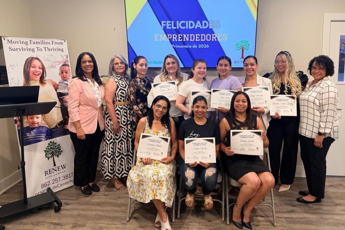 group of twelve women holding certificates of training